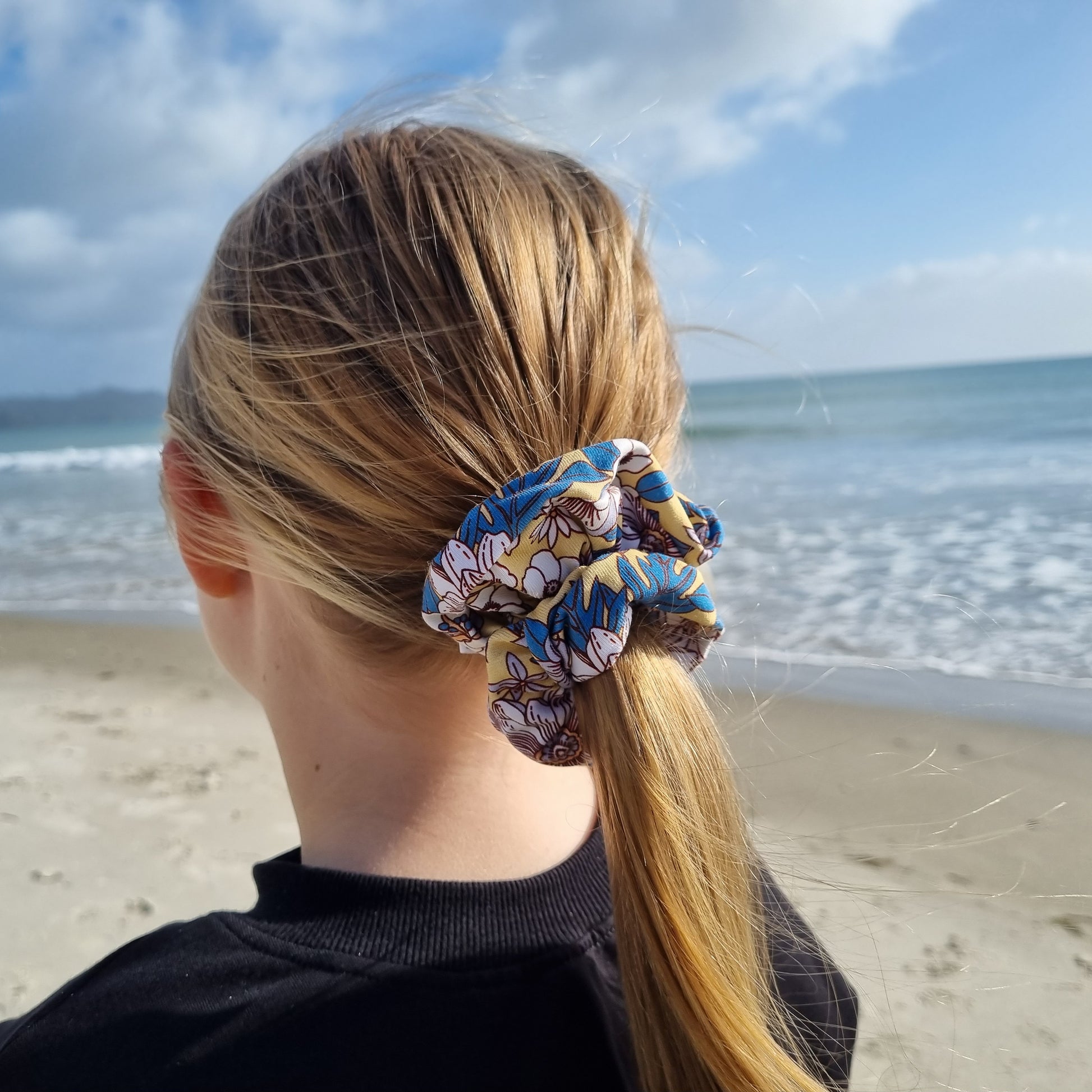 Scrunchie - April tied in girls hair at the beach. Blue and white flowers on yellow background.