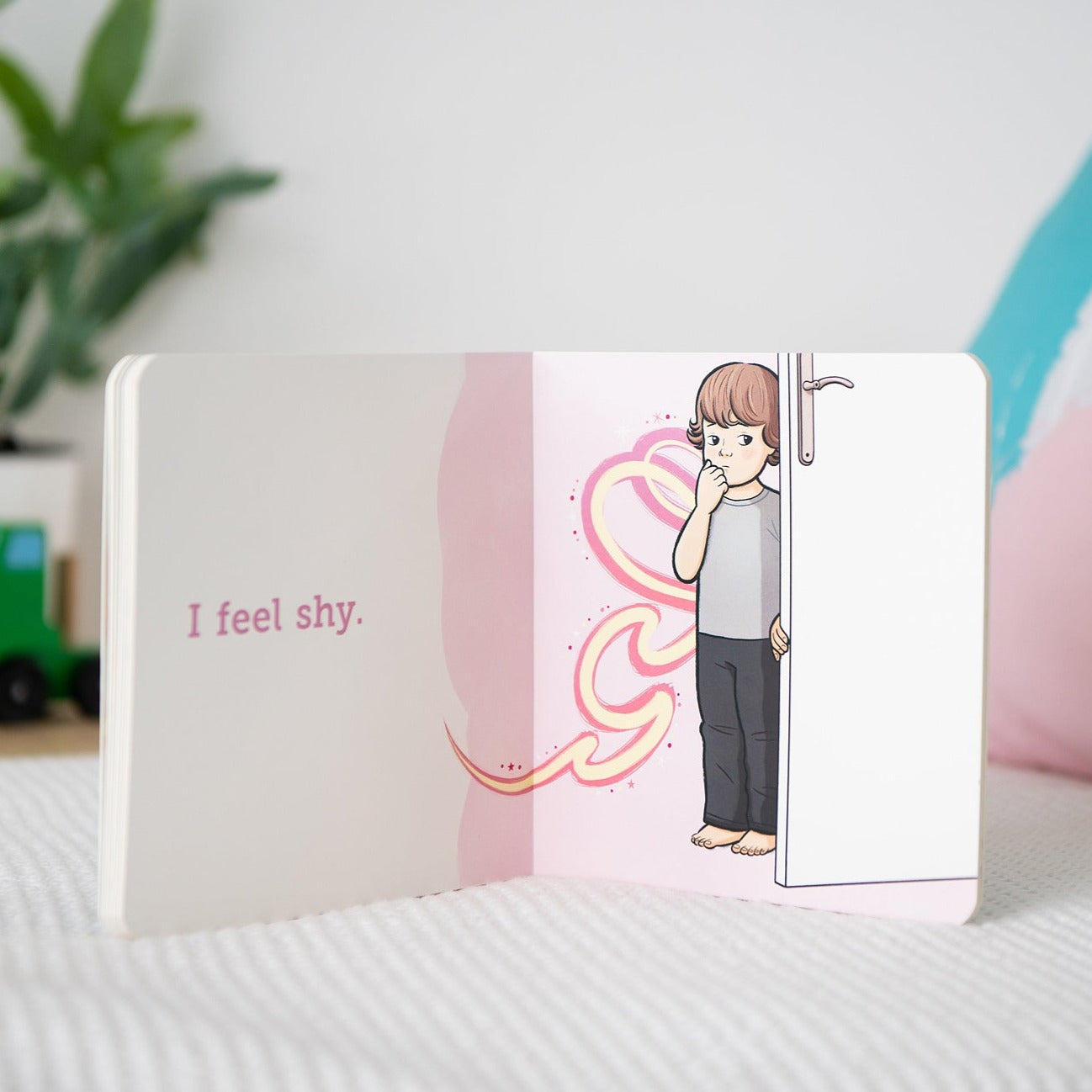 Page titled I feel shy with boy hiding behind door.